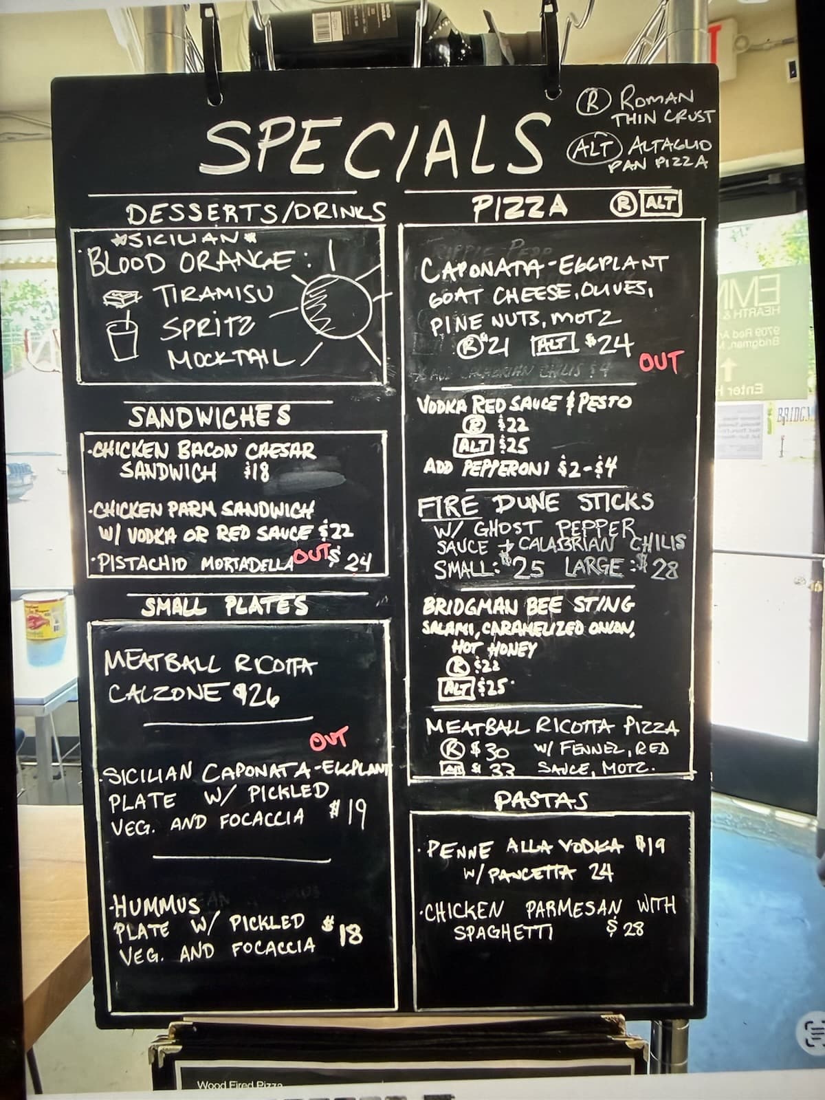 The Dugout specials board posted on 7/8/2026